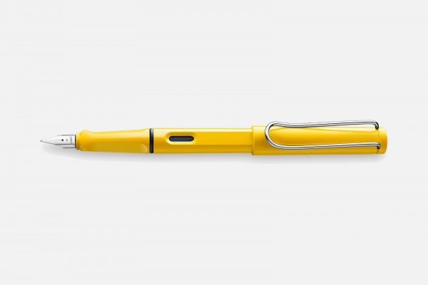a yellow lamy safari fountain pen on a grey background